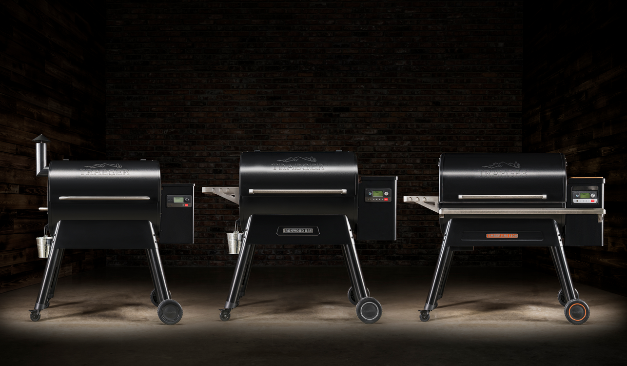 3 Traeger Grills against a dark background